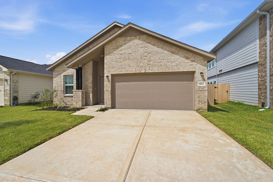 Front exterior of a new home in Bluestem, Brookshire, TX, highlighting curb appeal (Image 25).