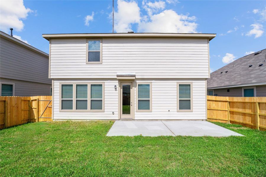 Step out onto the spacious patio slab, where outdoor entertaining comes to life. This backyard is ready for summer barbecues, parties, or simply relaxing with friends and family. Step out onto the spacious patio slab, where outdoor entertaining comes to life. This backyard is ready for summer barbecues, parties, or simply relaxing with friends and family.