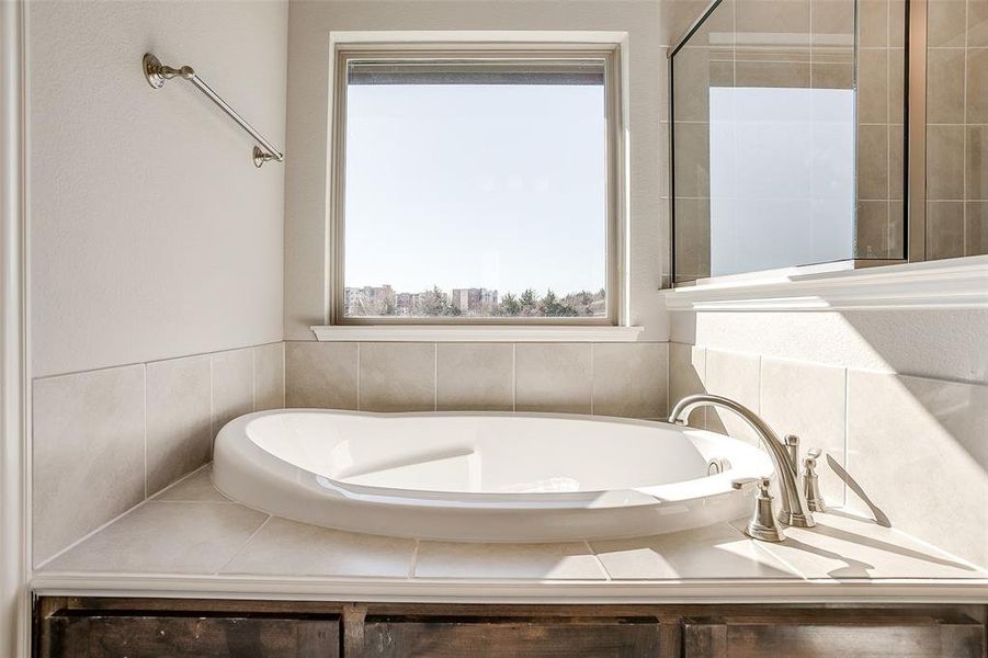 Bathroom featuring a tub Bathroom featuring a tub
