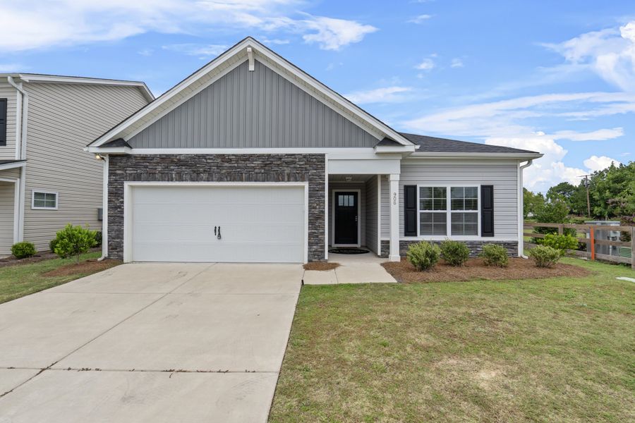 Front exterior of a new home in South Welcome, Greenville, SC, highlighting curb appeal (Image 2). Front exterior of a new home in South Welcome, Greenville, SC, highlighting curb appeal (Image 2).