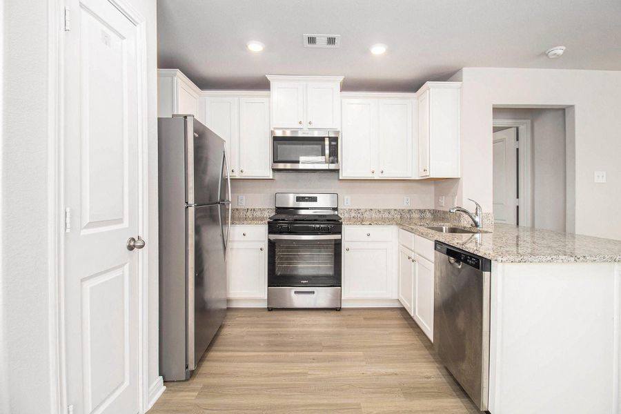 Furnished interior view inside a new home in Park Vista at El Tesoro, Houston (Image 9).