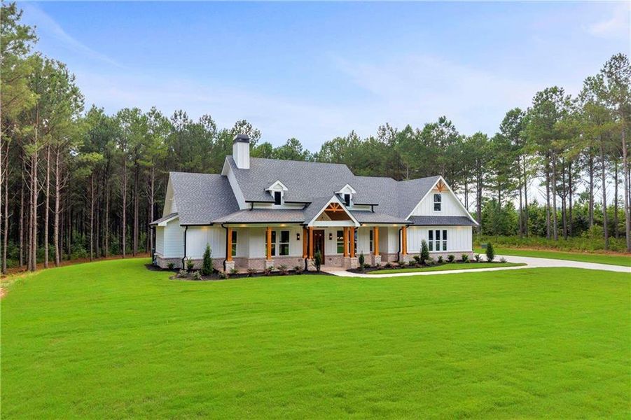 Front exterior of a new home in , Monroe, GA, highlighting curb appeal (Image 32).