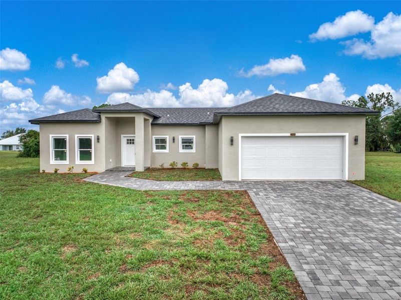 Front exterior of a new home in , Sebring, FL, highlighting curb appeal (Image 27).