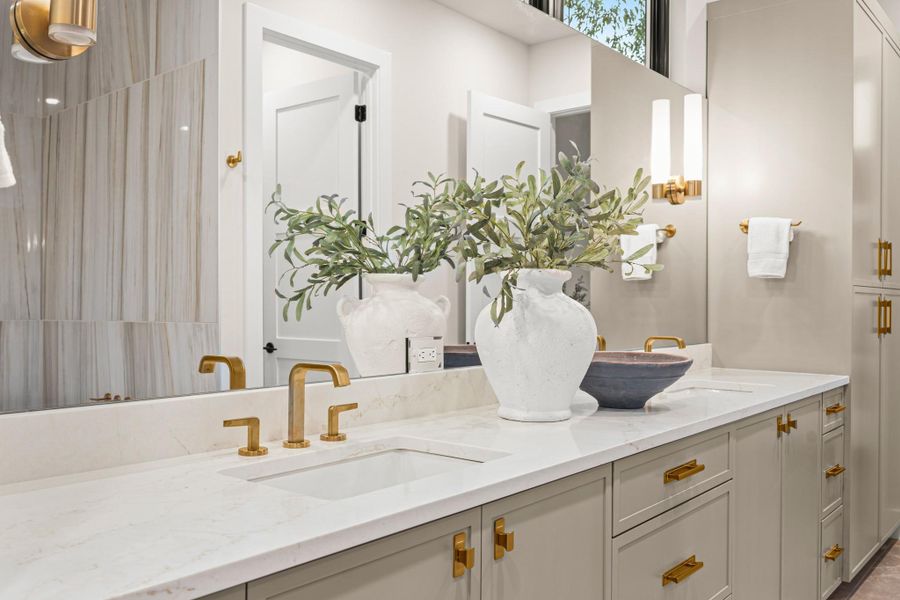 Full bath featuring double vanity and a shower