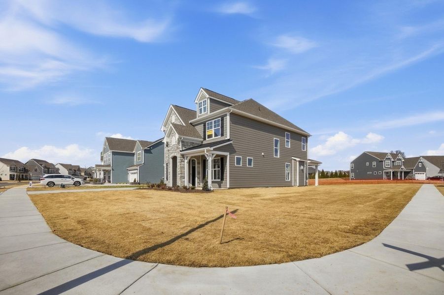 Front exterior of a new home in Harmony, Harrisburg, NC, highlighting curb appeal (Image 29). Front exterior of a new home in Harmony, Harrisburg, NC, highlighting curb appeal (Image 29).