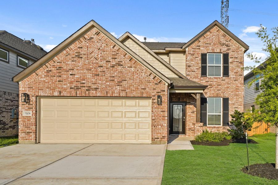 Front exterior of a new home in Sunterra North, Katy, TX, highlighting curb appeal (Image 19). Front exterior of a new home in Sunterra North, Katy, TX, highlighting curb appeal (Image 19).