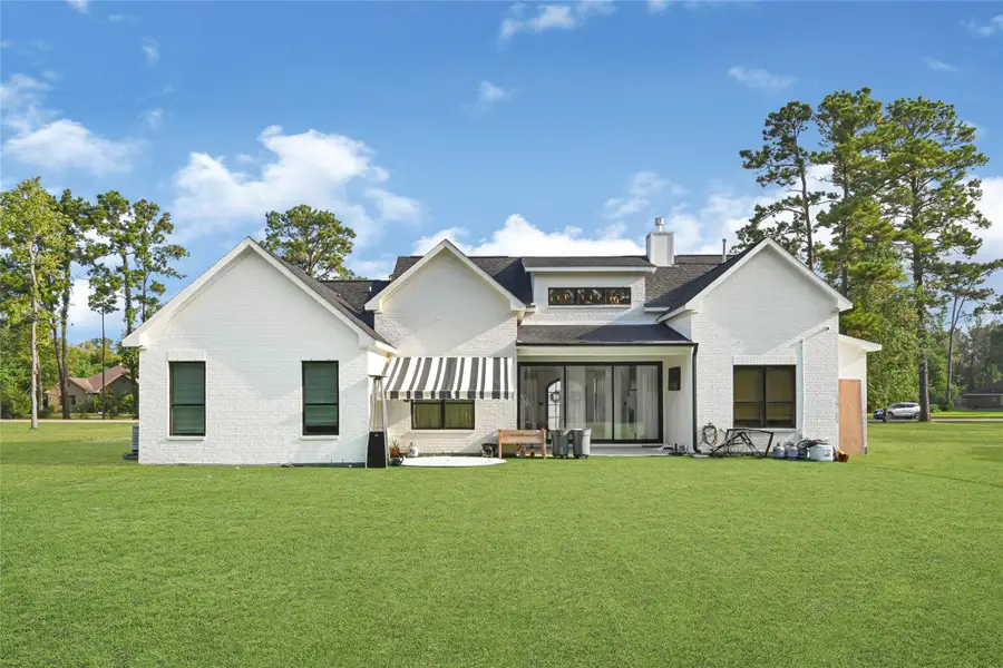 Rear Exterior. Low maintenance turf backyard designed for entertaining and year round enjoyment.
