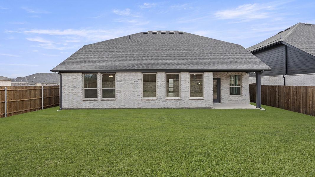 Exterior details and patio area of a home in Keeneland 50s, Aubrey (Image 4).