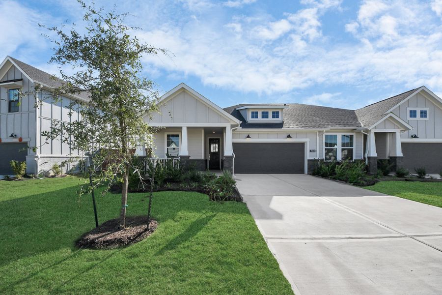 Front exterior of a new home in Elyson, Katy, TX, highlighting curb appeal (Image 2).