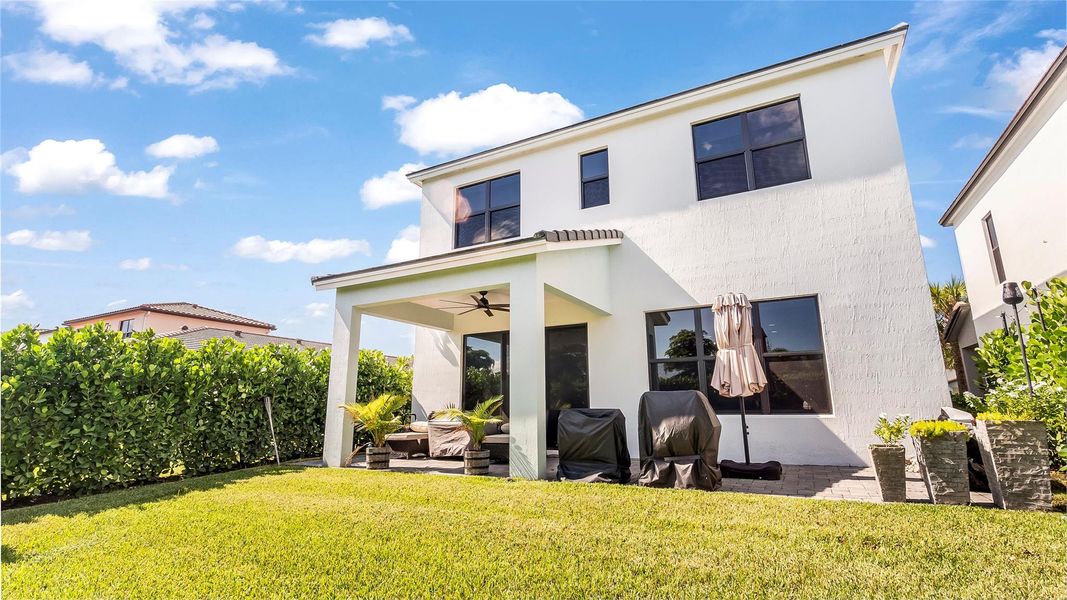 Front exterior of a new home in , Loxahatchee, FL, highlighting curb appeal (Image 24).