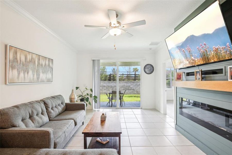 Living area with view of patio. Living area with view of patio.