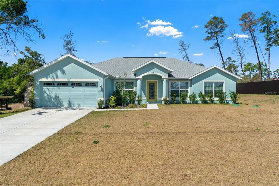 Front exterior of a new home in , Spring Hill, FL, highlighting curb appeal (Image 30).
