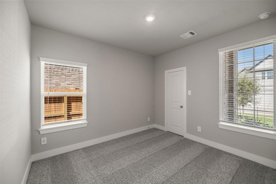 Three spacious secondary bedrooms upstairs, each with large closets and cozy carpet underfoot. Three spacious secondary bedrooms upstairs, each with large closets and cozy carpet underfoot.