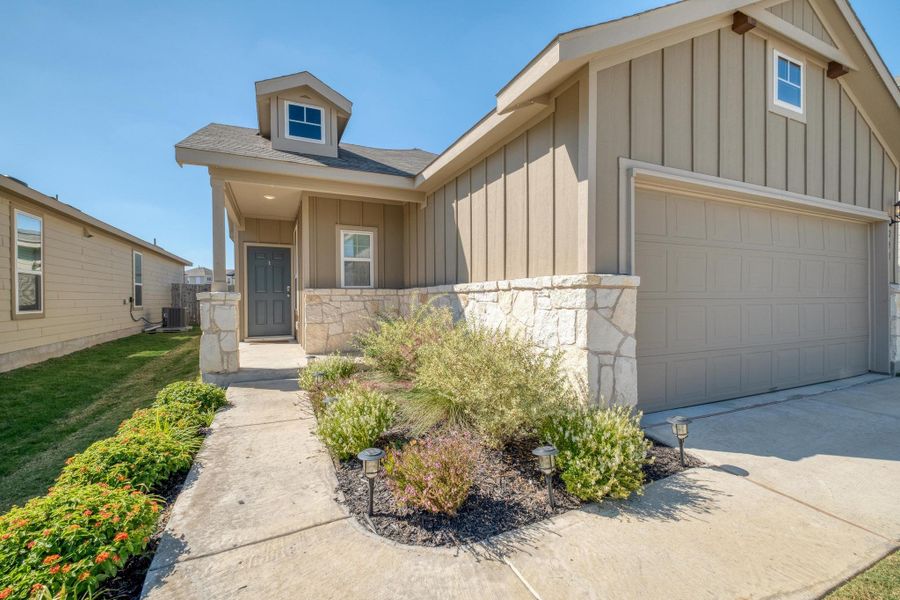 Front exterior of a new home in , Buda, TX, highlighting curb appeal (Image 23). Front exterior of a new home in , Buda, TX, highlighting curb appeal (Image 23).