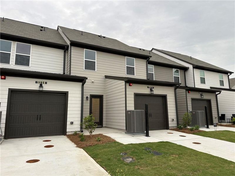 Front exterior of a new home in Laurelwood, Douglasville, GA, highlighting curb appeal (Image 16).