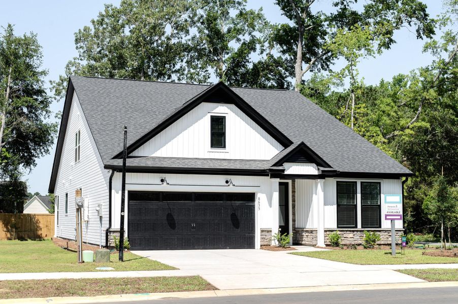 Front exterior of a new home in Indigo Place, North Charleston, SC, highlighting curb appeal (Image 27). Front exterior of a new home in Indigo Place, North Charleston, SC, highlighting curb appeal (Image 27).
