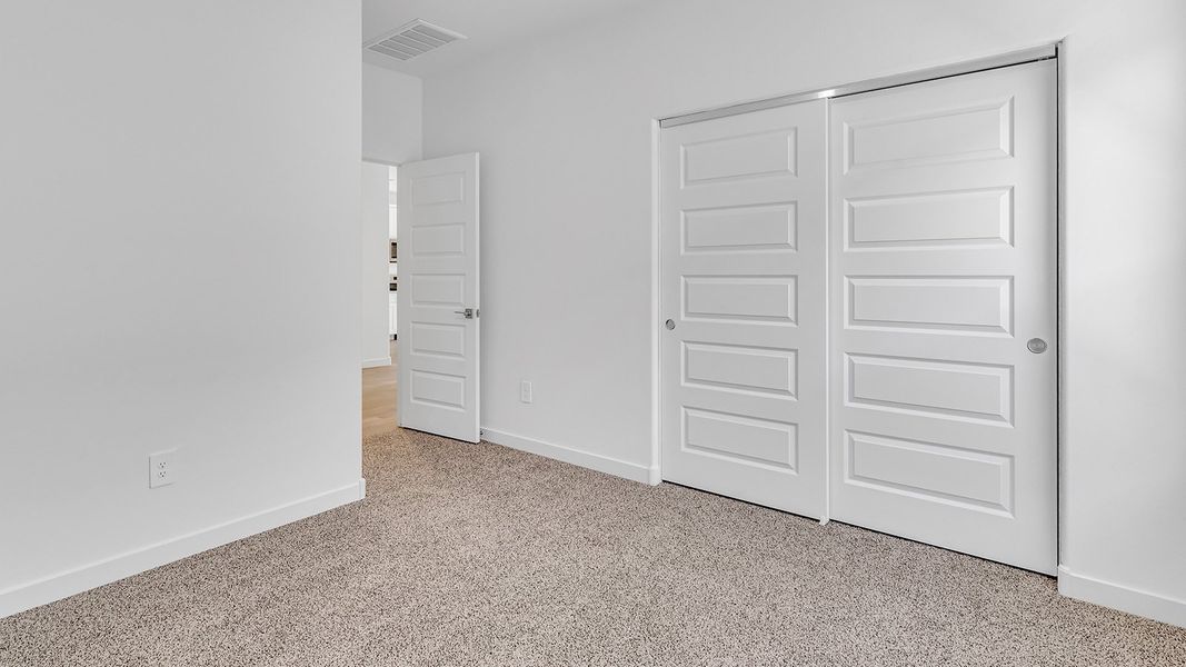 Representative unfurnished interior of a home built from the Harris by D.R. Horton in The Oasis at Rocking K, Vail (Image 21).