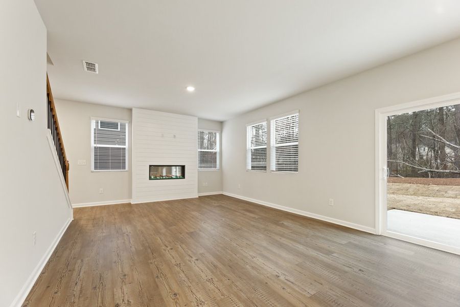 A room with a wood floor and a wood floor. A room with a wood floor and a wood floor.