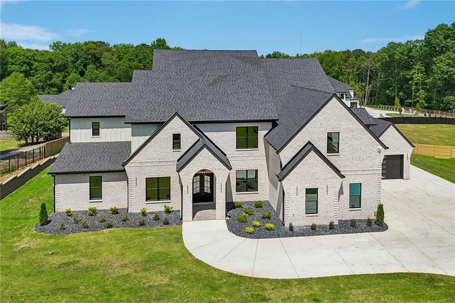 Front exterior of a new home in , Buford, GA, highlighting curb appeal (Image 29). Front exterior of a new home in , Buford, GA, highlighting curb appeal (Image 29).