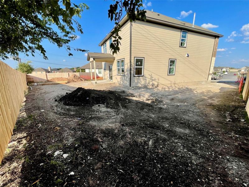 Front exterior of a new home in Covered Bridge, Hutto, TX, highlighting curb appeal (Image 19). Front exterior of a new home in Covered Bridge, Hutto, TX, highlighting curb appeal (Image 19).
