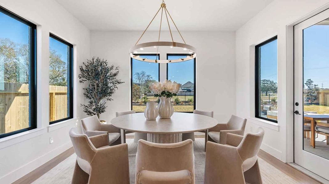 A separate dining room with large windows for maximum natural lighting and a gorgeous view of the backyard