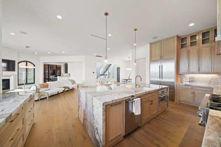 A view of the kitchen into the living space. Uninterrupted luxury lives here.