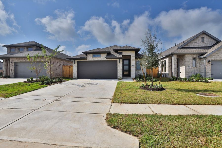 Front exterior of a new home in The Grand Prairie, Hockley, TX, highlighting curb appeal (Image 2).