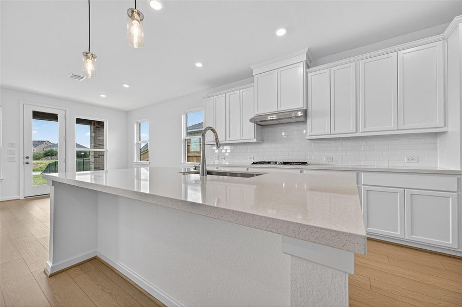 The quartz countertops add a touch of elegance and durability, blending modern design with everyday functionality