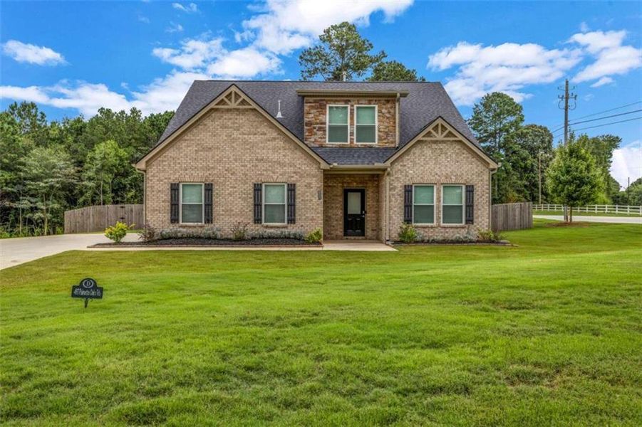 Front exterior of a new home in Palmetto Oaks Phase III, Palmetto, GA, highlighting curb appeal (Image 2). Front exterior of a new home in Palmetto Oaks Phase III, Palmetto, GA, highlighting curb appeal (Image 2).
