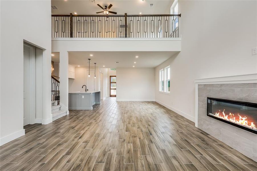 Wide open spaces and gorgeous tile-backed fireplace- you can take that tile all the way to the ceiling for a more dramatic effect.