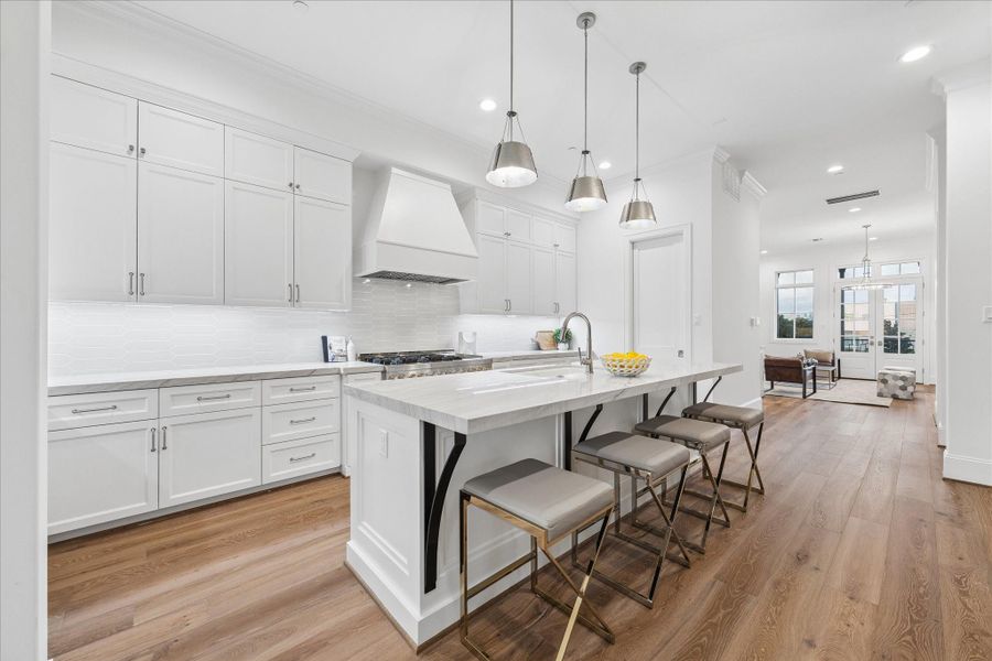 Another view of the beautiful kitchen showing how it flows to the living room.