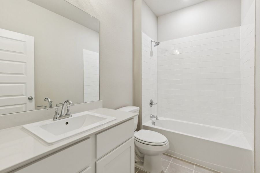 Bathroom in the Stanley II home plan by Trophy Signature Homes – REPRESENTATIVE PHOTO
