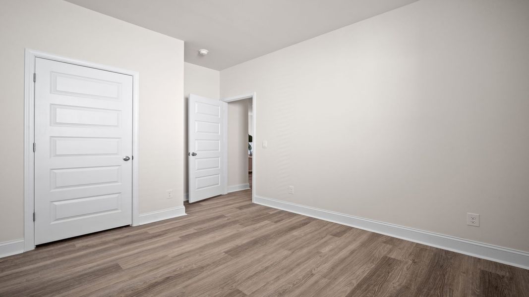 Spacious, unfurnished interior of a new home in The Groves at Bees Creek, Ridgeland (Image 22).