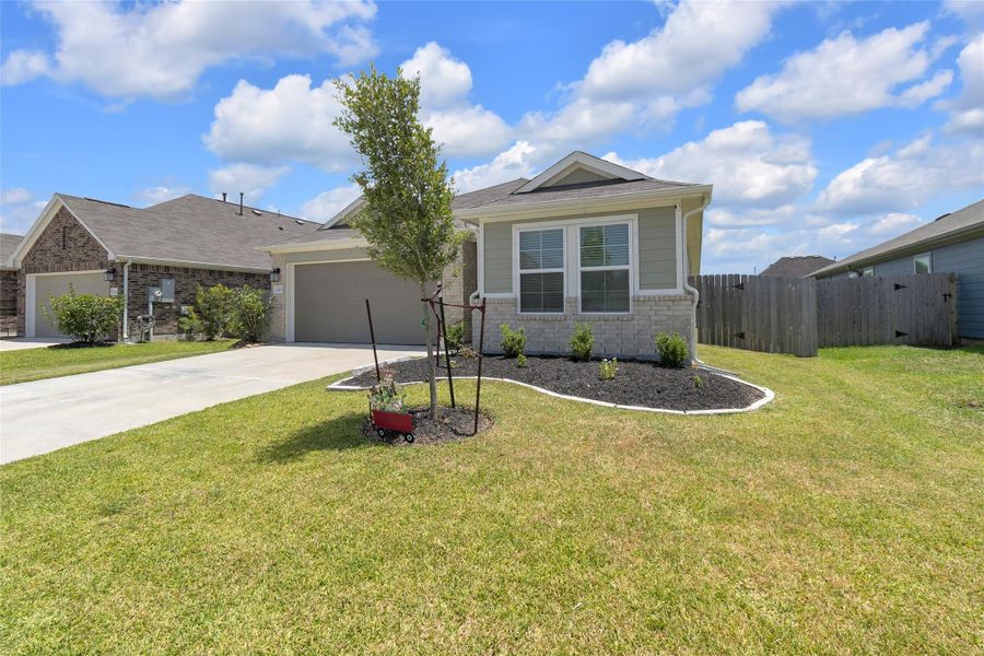 Front exterior of a new home in Mustang Crossing, Alvin, TX, highlighting curb appeal (Image 21).