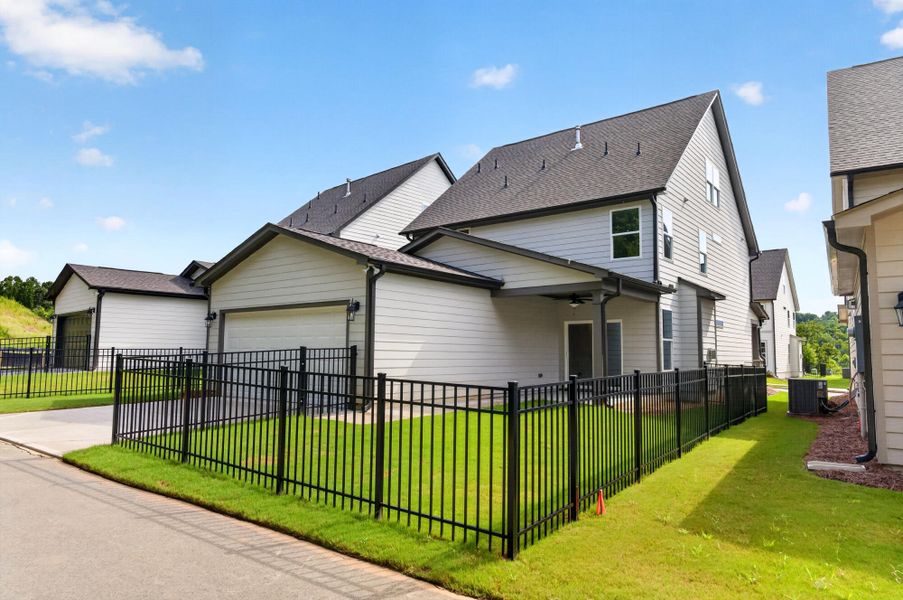 Front exterior of a new home in Marble Tree, Ball Ground, GA, highlighting curb appeal (Image 20). Front exterior of a new home in Marble Tree, Ball Ground, GA, highlighting curb appeal (Image 20).