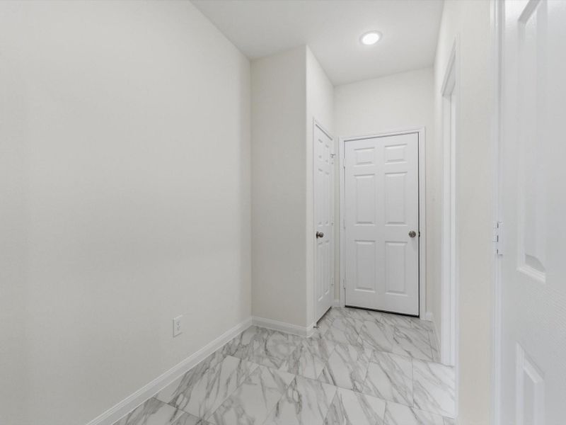 The mud room conveniently connects the garage to the home, creating an easy and functional everyday entry point.