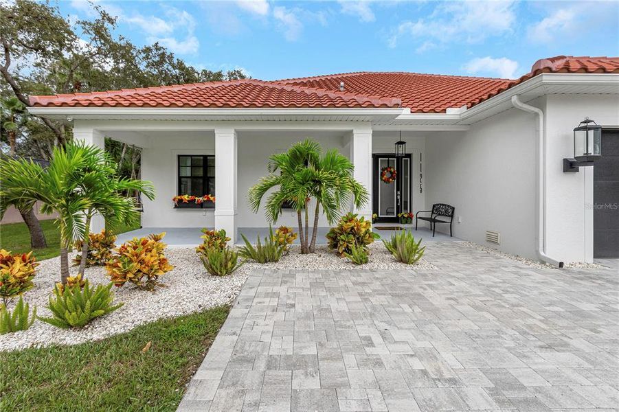 Front exterior of a new home in , Tarpon Springs, FL, highlighting curb appeal (Image 24).