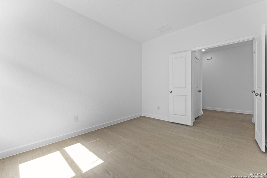 Spacious, unfurnished interior of a new home in Waterwheel: Coastline Collection, San Antonio (Image 22).