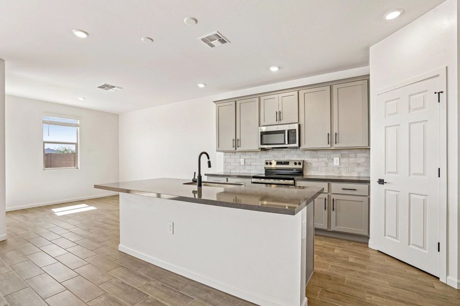 Kitchen featuring the Foundry Collection and dining Kitchen featuring the Foundry Collection and dining