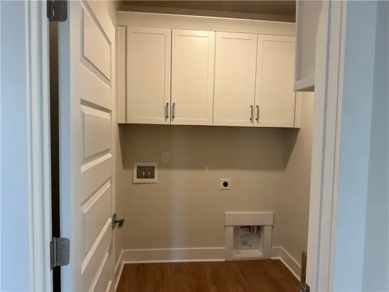 Ample built-in cabinetry and durable wood-look flo