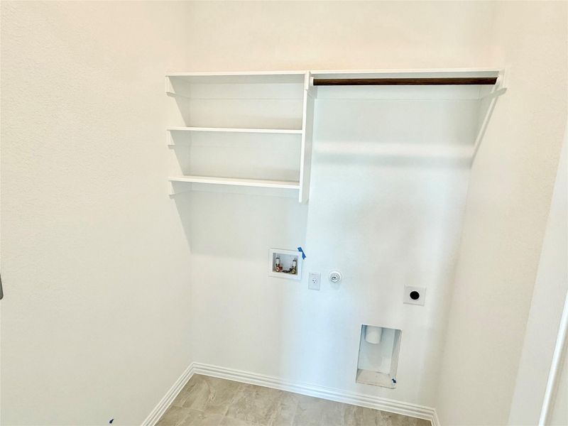 Laundry area with washer hookup, electric dryer hookup, and gas dryer hookup