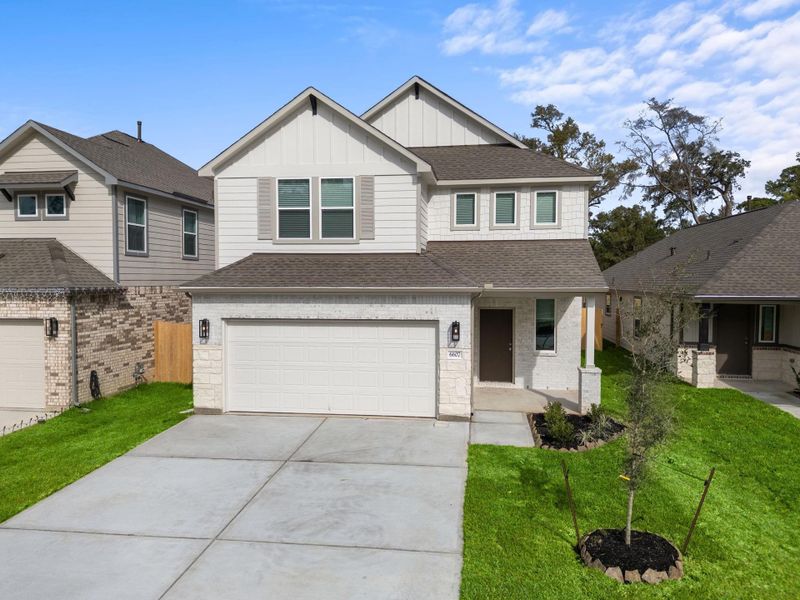 Front exterior of a new home in Cypresswood Landing, Humble, TX, highlighting curb appeal (Image 15). Front exterior of a new home in Cypresswood Landing, Humble, TX, highlighting curb appeal (Image 15).