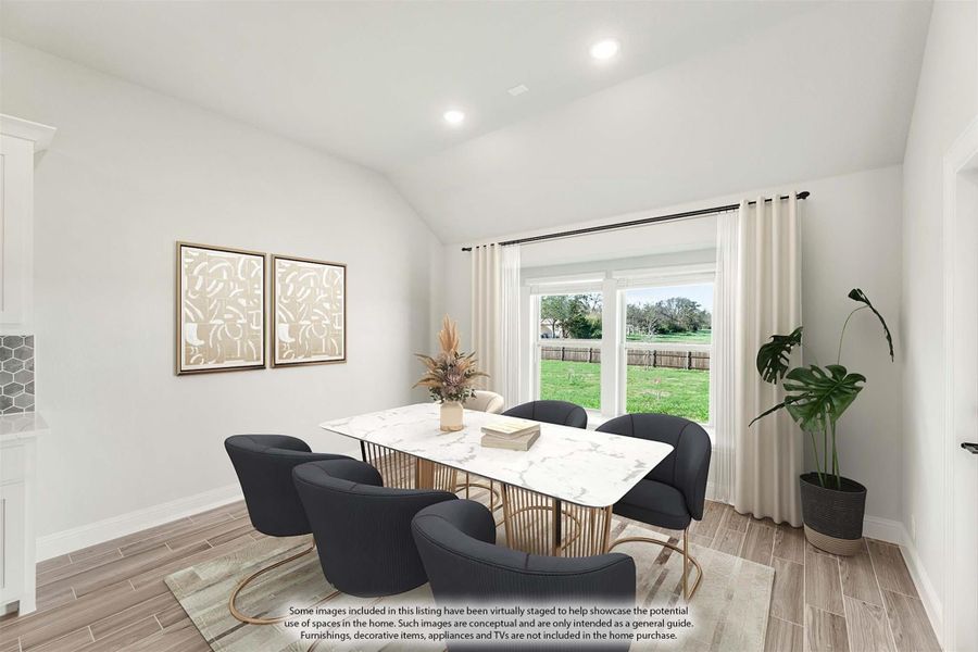 Dining room with marble-top table, dark chairs, vaulted ceiling, and large window overlooking backyard Dining room with marble-top table, dark chairs, vaulted ceiling, and large window overlooking backyard