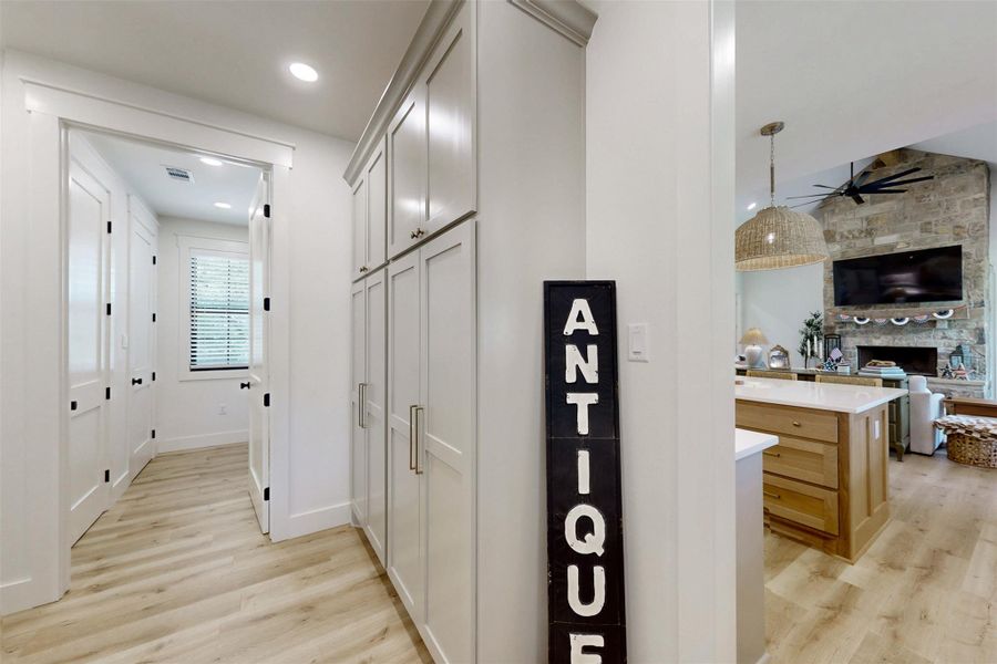 Hall featuring light wood-type flooring and recessed lighting