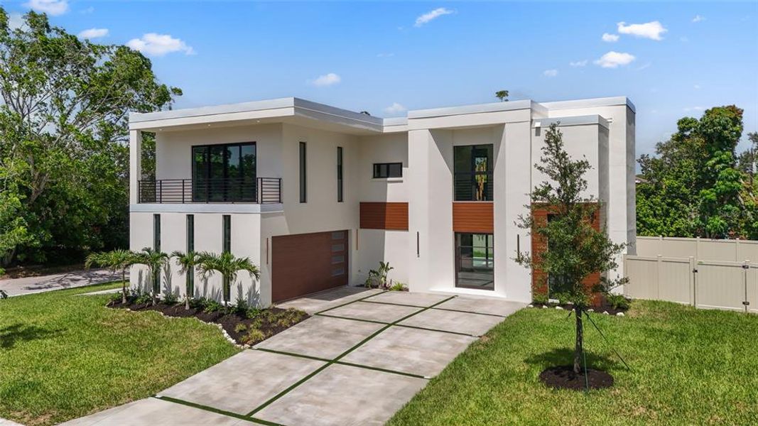 Front exterior of a new home in , Sarasota, FL, highlighting curb appeal (Image 33).