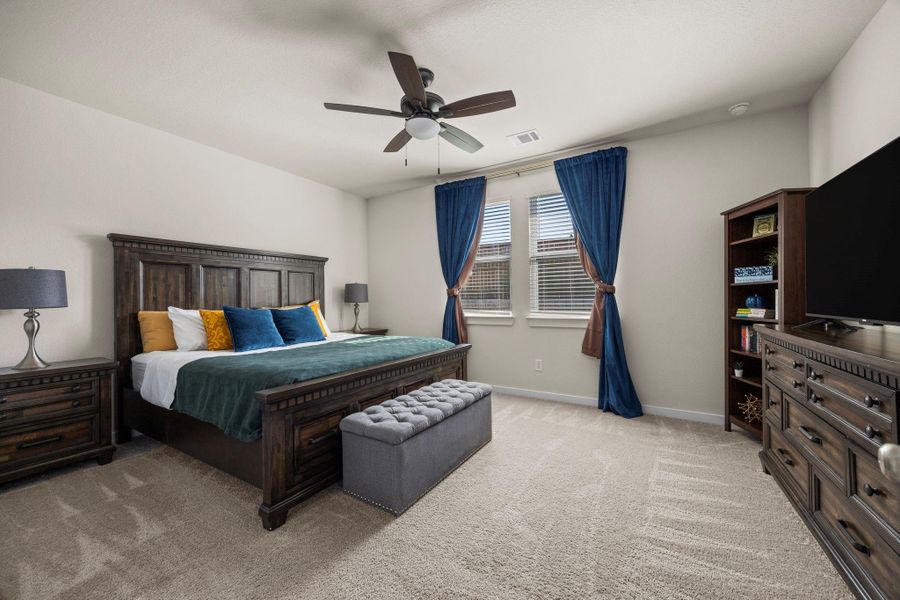 This generous primary suite provides a peaceful retreat. With plenty of space for a king-sized bed and additional furniture, this room is your personal sanctuary.