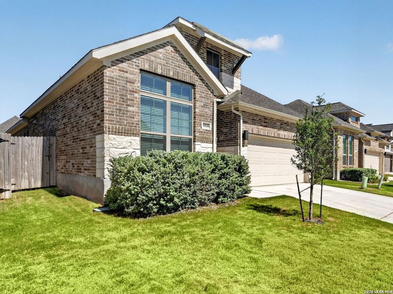 Front exterior of a new home in Kallison Ranch, San Antonio, TX, highlighting curb appeal (Image 21). Front exterior of a new home in Kallison Ranch, San Antonio, TX, highlighting curb appeal (Image 21).