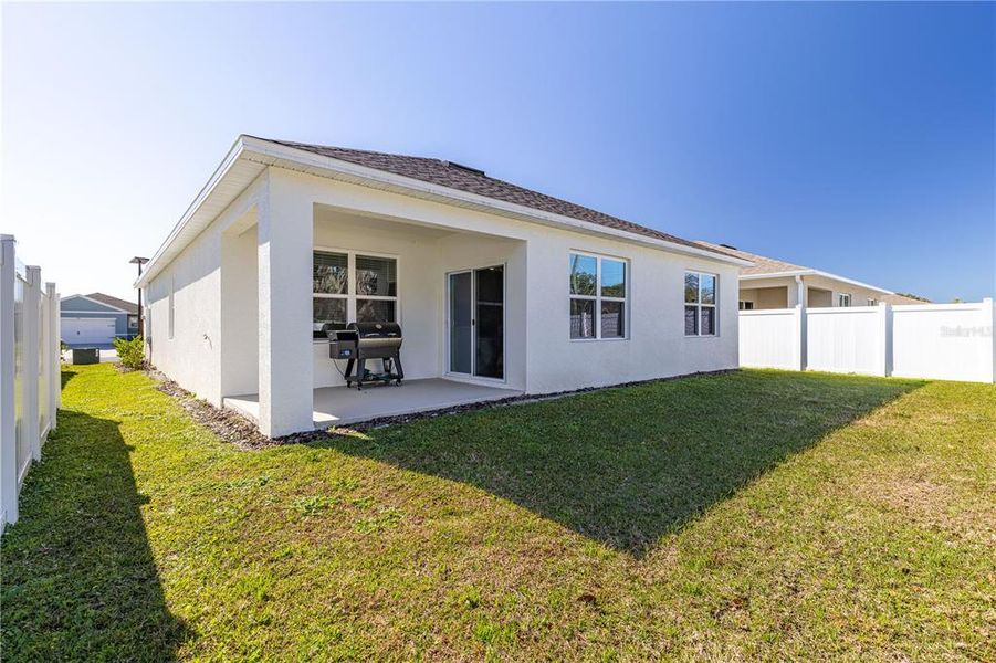 Exterior details and patio area of a home in Magnolia Pointe, Umatilla (Image 29).