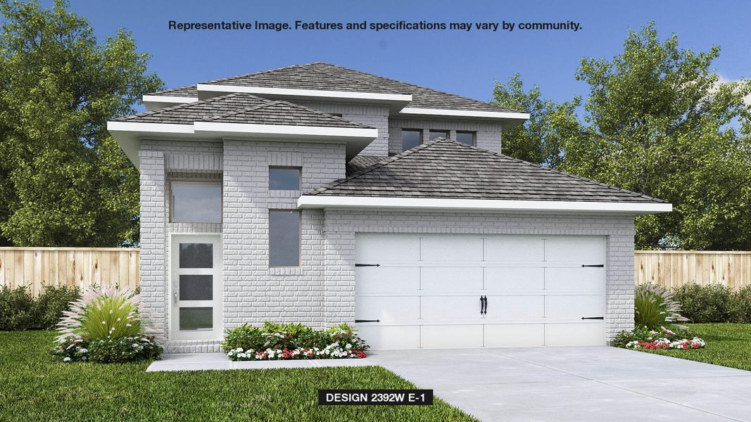 View of front of house with brick siding, a garage, and driveway View of front of house with brick siding, a garage, and driveway
