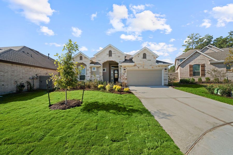 Exterior details and patio area of a home in Artavia, Conroe (Image 1).